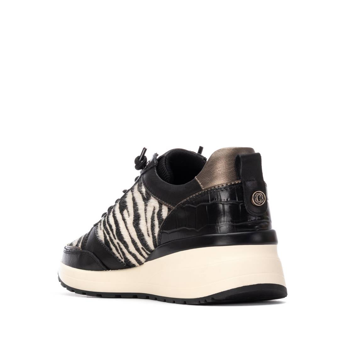 Leder-Sneaker mit Zebramuster und Keilsohle in Schwarz-Weiß